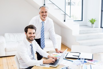 Aufkleber - Businessmen discussing office work on laptop