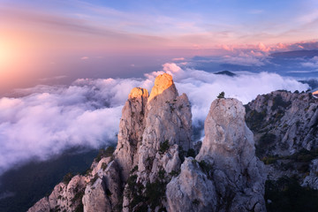 Wall Mural - mountain landscape at sunset. amazing view from mountain peak on the high rocks, blue sky, clouds an