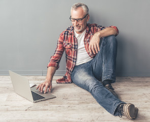 Poster - Handsome mature man with gadget