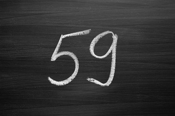 Wall Mural - number fifty nine enumeration written with a chalk on the blackboard