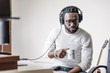 © santypan - Artist producing music in his home sound studio.