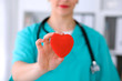© rogerphoto - Female surgeon doctor with stethoscope holding heart.