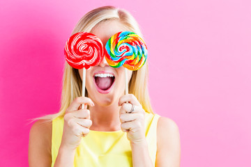 Sticker - Young woman eating a lollipop