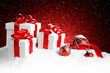 christmas gift with balls bow red background