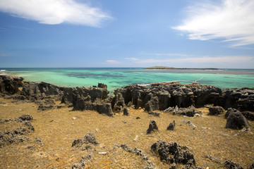 bay amoronia indian ocean, orange cove is lined with sharp rocks, north of madagascar