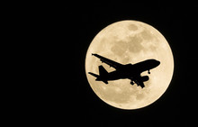 Silhouettes Of Aircraft And Super Moon, Full Moon