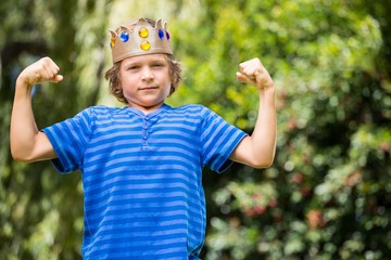 Poster - Cute boy with a crown showing his muscles