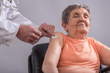 Wall Mural - Vaccination of an elderly woman