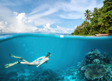 Young Woman Snorkeling In Clear Tropical Waters In Near Of Exotic Island.