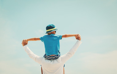 Poster - happy father and son playing on sky