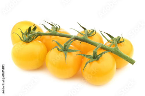 fresh yellow tasty tom tomatoes on the vine on a white background Fototapet
