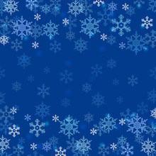 Winter Border With White And Blue Snowflakes On Blue Blurred Soft Background. Christmas And New Year Holiday Wallpaper