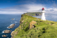 Mykines Island, Faroe Islands, Denmark. Lighthouse And Cliffs.