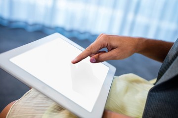 Poster - Close up of hand using a tablet
