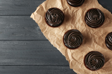 Canvas Print - Tasty cupcakes on paper, top view