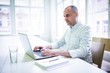 © WavebreakMediaMicro - Businessman using laptop
