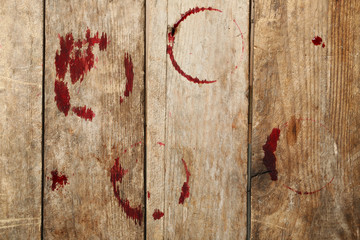 Wall Mural - Red wine stains on wooden background