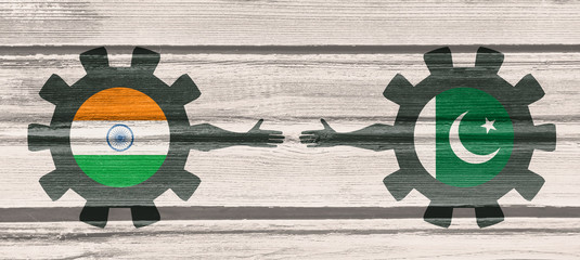 Wall Mural - Web Banner, Header Layout Template. Politic and economic relationship between India and Pakistan. National flags on cog wheels. Wood texture