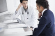 © Monet - Businessmen are being consulted at a hospital