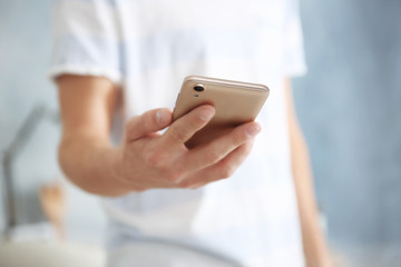 Canvas Print - Man holding smart phone, closeup