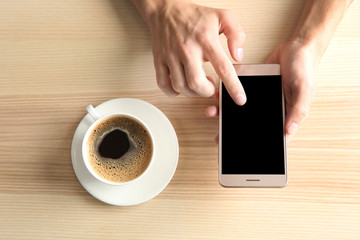 Poster - Man using smart phone in cafe