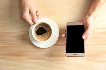 Poster - Man using smart phone in cafe