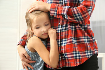 Canvas Print - Mother hugging cute little girl, close up view