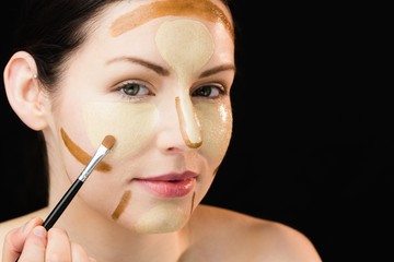 Woman doing contouring on her face