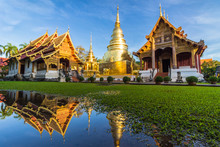 Wat Phra Singh Temple, Blue Sky And Reflection In Water. Chiang Mai, Thailand.