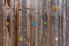 Old Wood Climbing Wall With Toe And Hand Hold Studs.