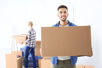 House moving concept. Man holding cardboard box, closeup