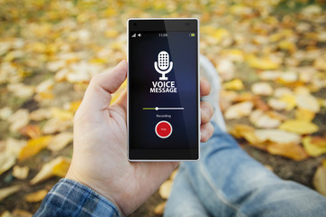 man in the park recording voice message