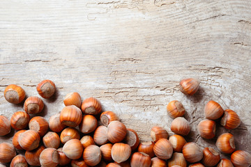 Wall Mural - Hazelnut. Fresh organic filbert. Nuts on wooden background.