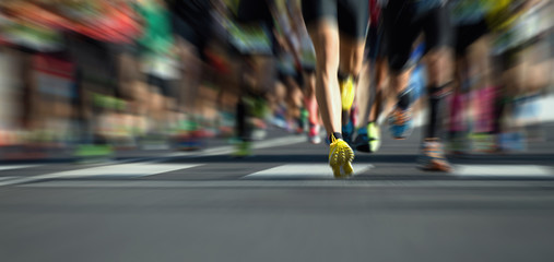 Wall Mural - Marathon running race people feet on city road,abstract