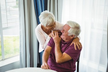 Wall Mural - Senior couple hugging each other