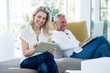 © WavebreakmediaMicro - Smiling mature couple using technology
