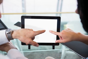 Poster - Businessman discussing with colleague over digital tablet