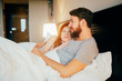 © NDABCREATIVITY - Sensual couple in bed being romantic