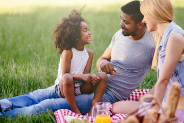 Wall Mural - Happy family enjoying picnic