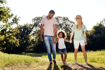 Playful faimly outdoors walking