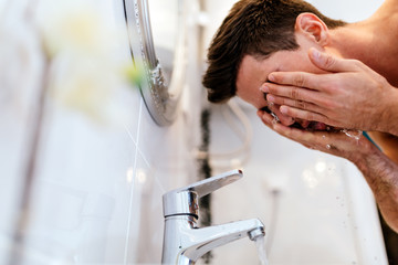 Man washing face in morning