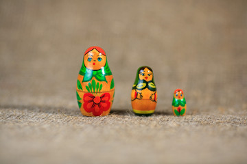 Russian dolls. Matryoshka on linen fabric for the background.