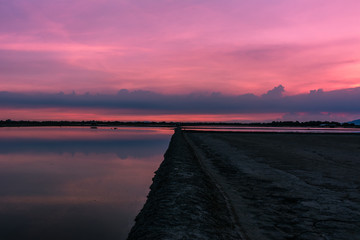 Wall Mural - Beautiful landscape at sunset salt Farm. Salt Farm is the place with so much sea-salt production in the country, Thailand.