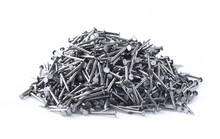 pile of metal nails on a white background
