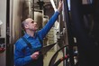 © WavebreakMediaMicro - Male manufacturer examining machinery