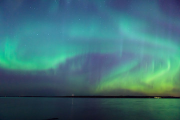 Wall Mural - northern lights over lake in finland