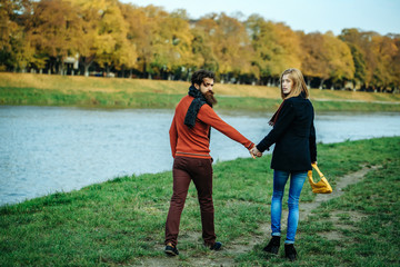 Wall Mural - Young couple in autumn park