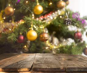 Wall Mural - christmas table background with christmas tree out of focus