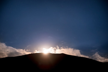 Wall Mural - raising of full moon above mountain