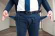 © Catalin Pop - Closeup of male realtor showing his empty pockets
